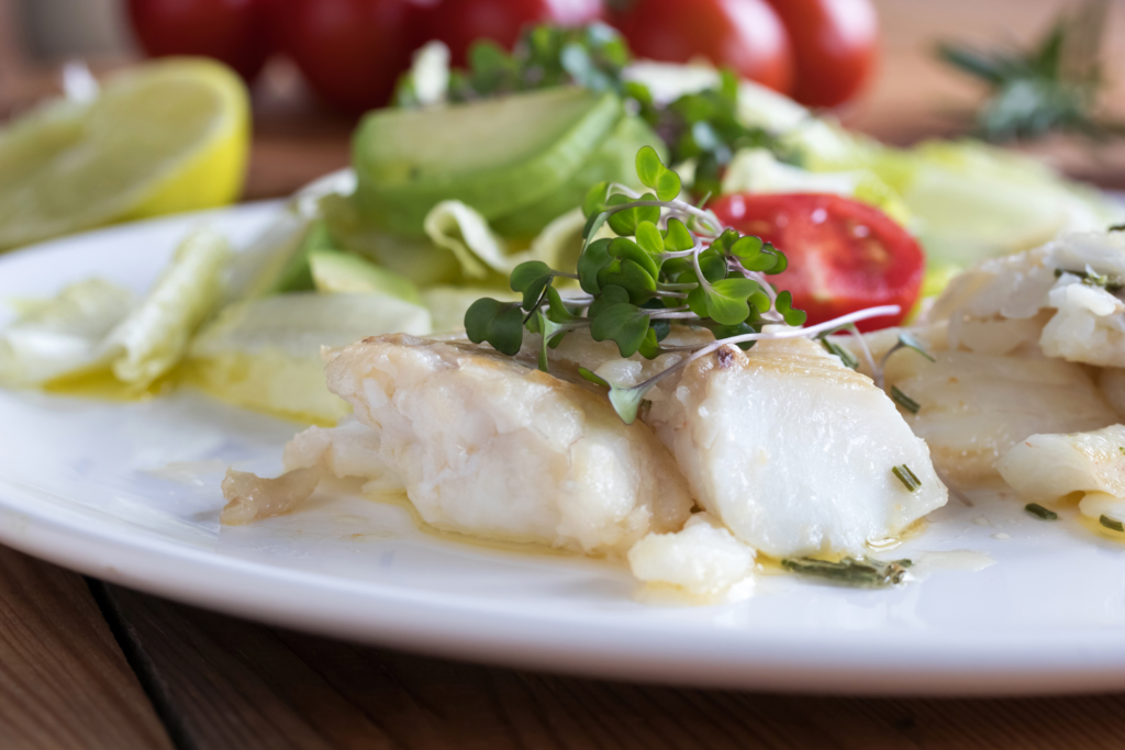 Baked cod fish with fresh microgreens Baked cod fish with fresh microgreens
